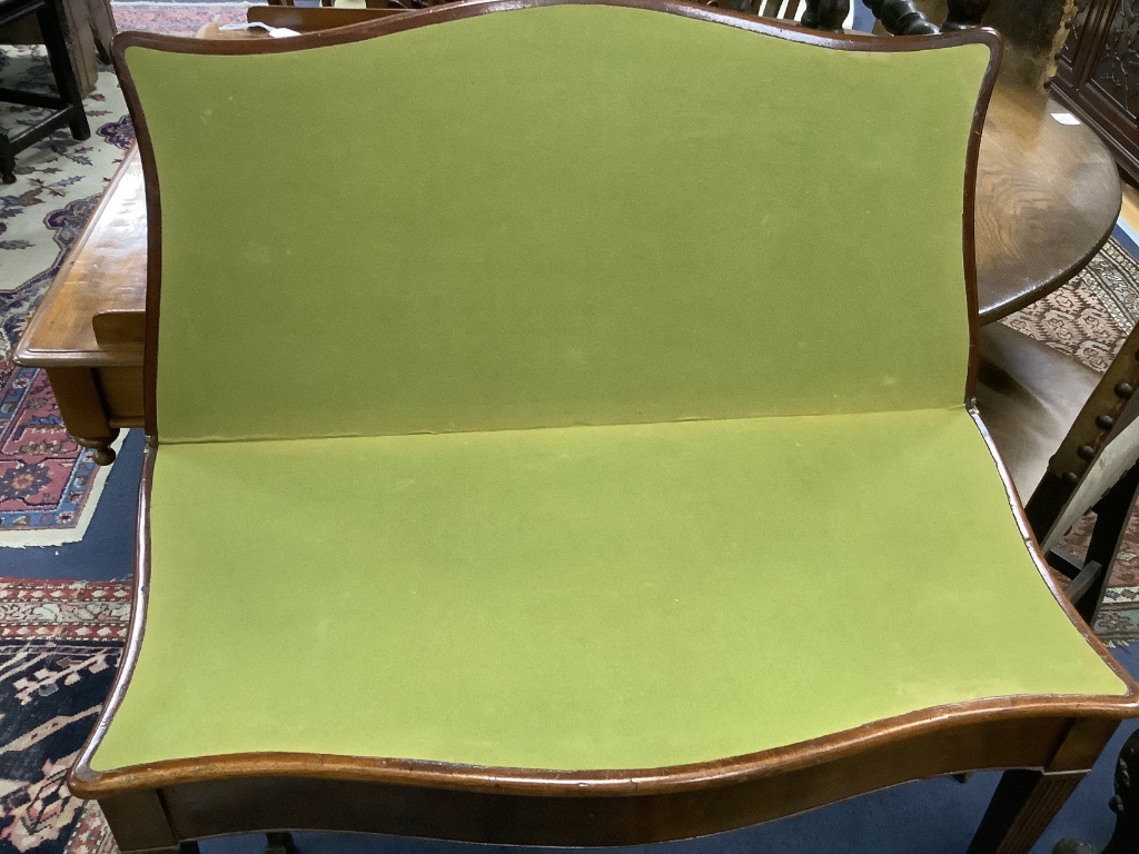 A George III style mahogany serpentine folding card table, width 87cm, depth 44cm, height 74cm
